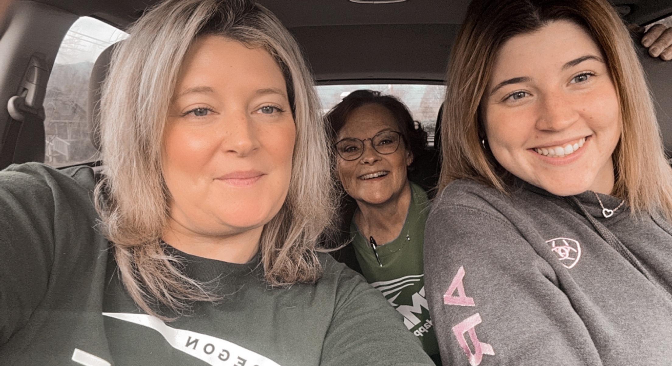 Three Grants Pass members taking a car selfie on their way to go door knocking